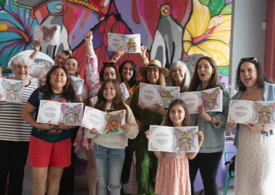 Author Annie Reyes standing with all her guests after finishing their art work