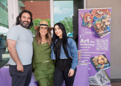 Author Annie Reyes smiling with her son and daughter